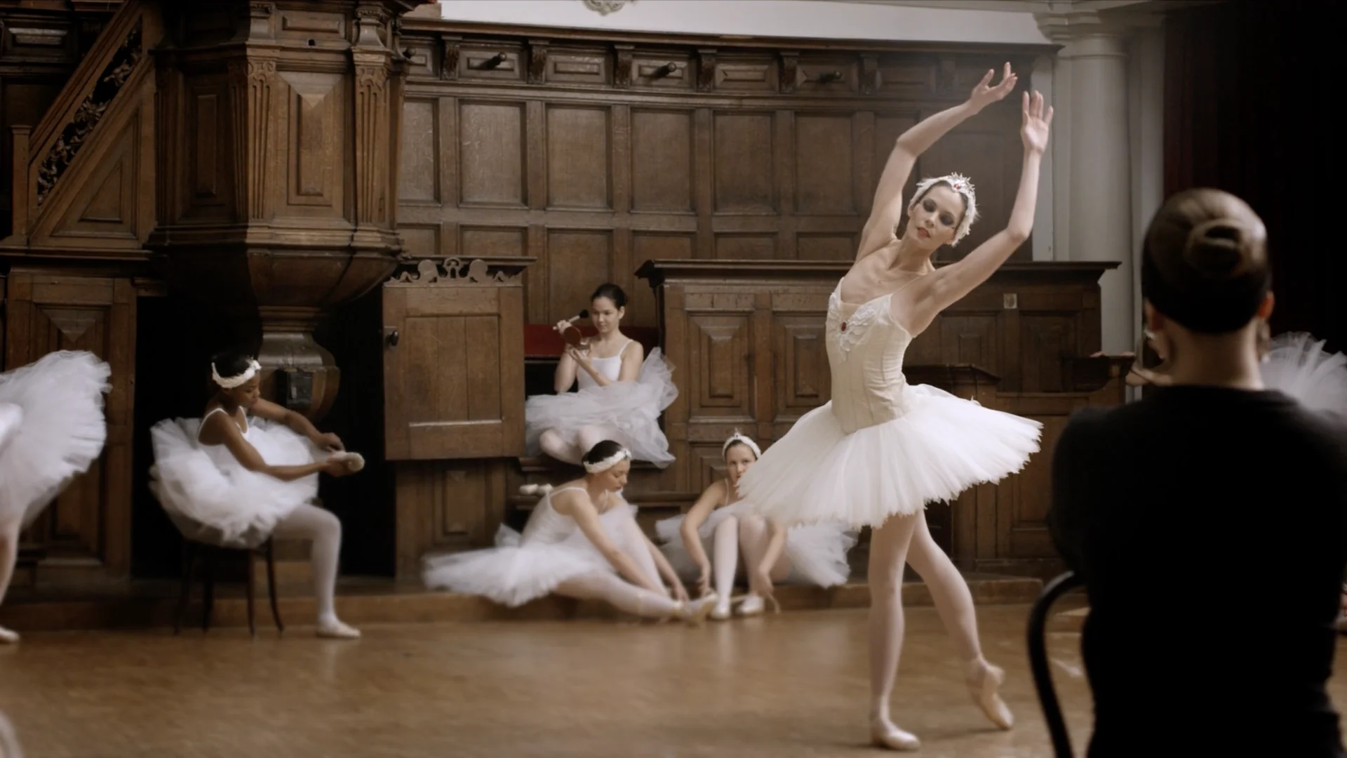 Igone de Jongh dances for a teacher in black while the swans wait at the side