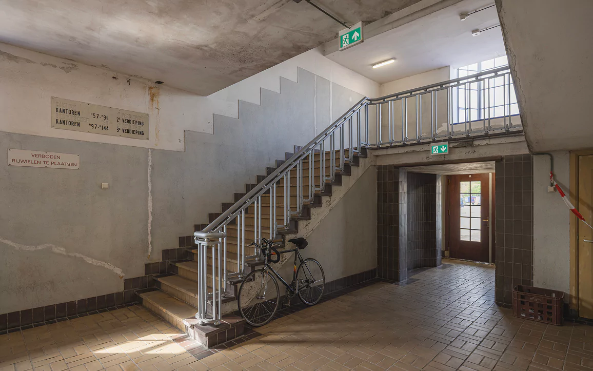 An empty stairwell with tiled floors