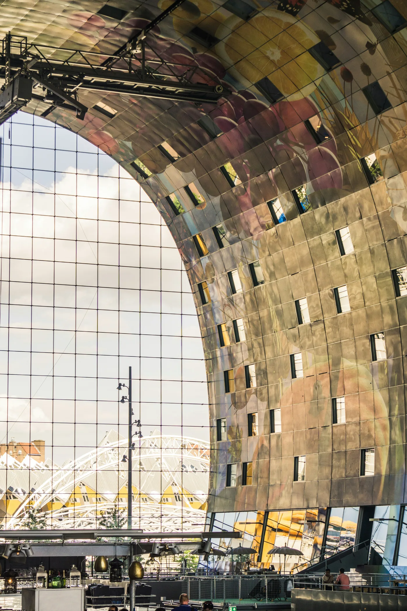 Inside the Markthal, the painted arch with the Cube Houses seen through the glass