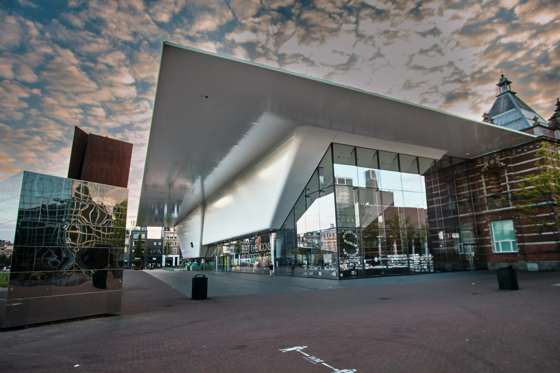 The Stedelijk Museum on the Museumplein under an evening sky