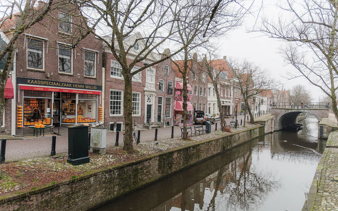 A street of old houses along a canal in Edam