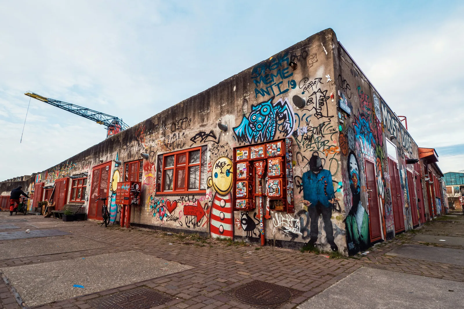 A warehouse covered in graffiti at the NDSM wharf
