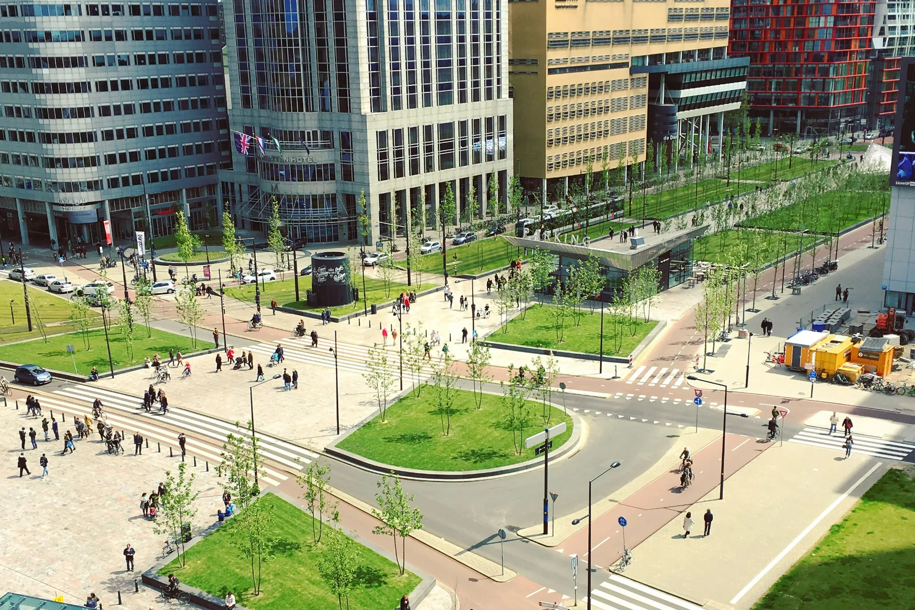 Wide streets, cycle paths and crossings by Rotterdam Centraal seen from above